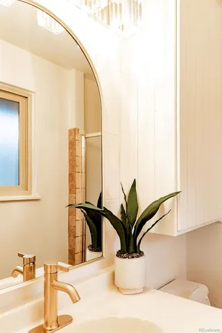 a view of a bathroom with sink and mirror