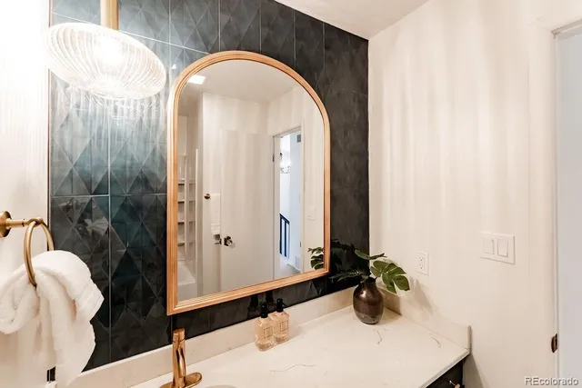 a living room with furniture a table and a potted plant