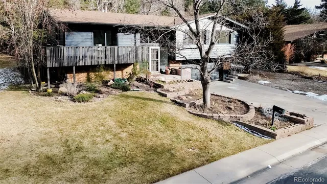 an aerial view of a house with a yard basket ball court