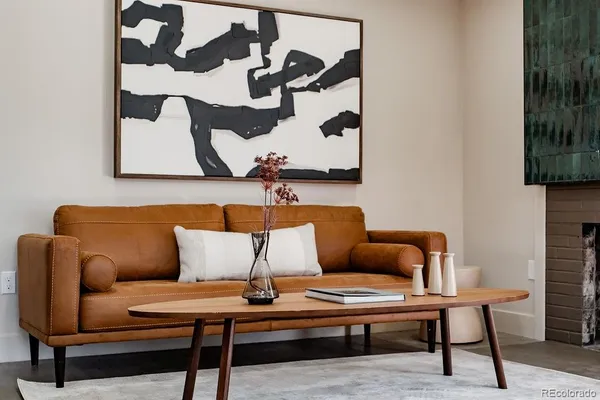 a living room with furniture and a rug