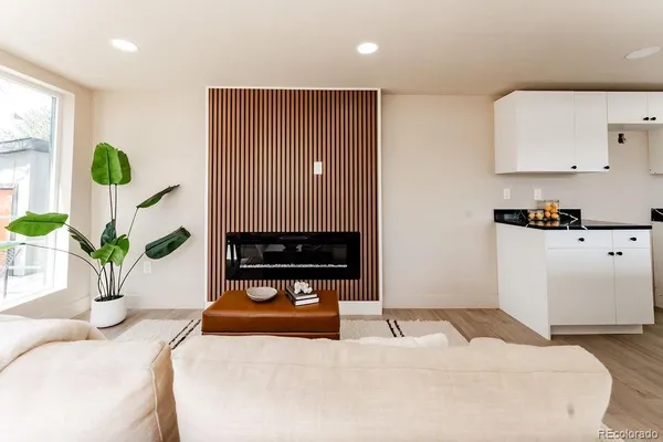 a bedroom with a bed and a potted plant