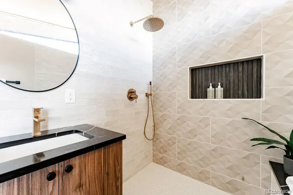 a bathroom with a sink and a mirror