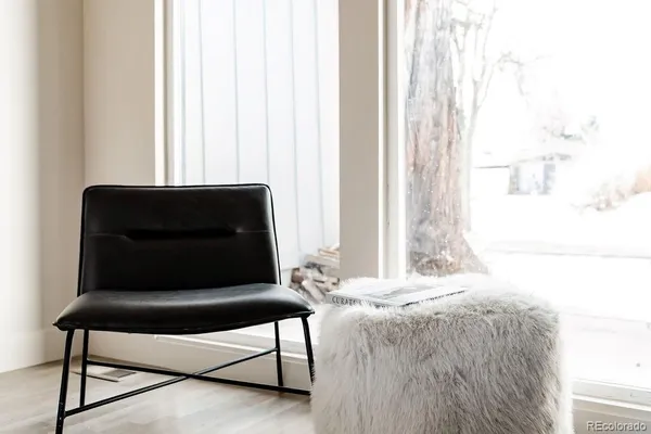 a living room with a couch and a window