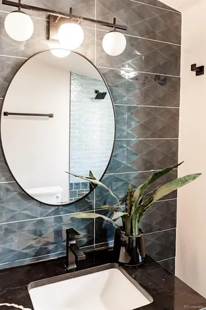 a bathroom with a sink and mirror