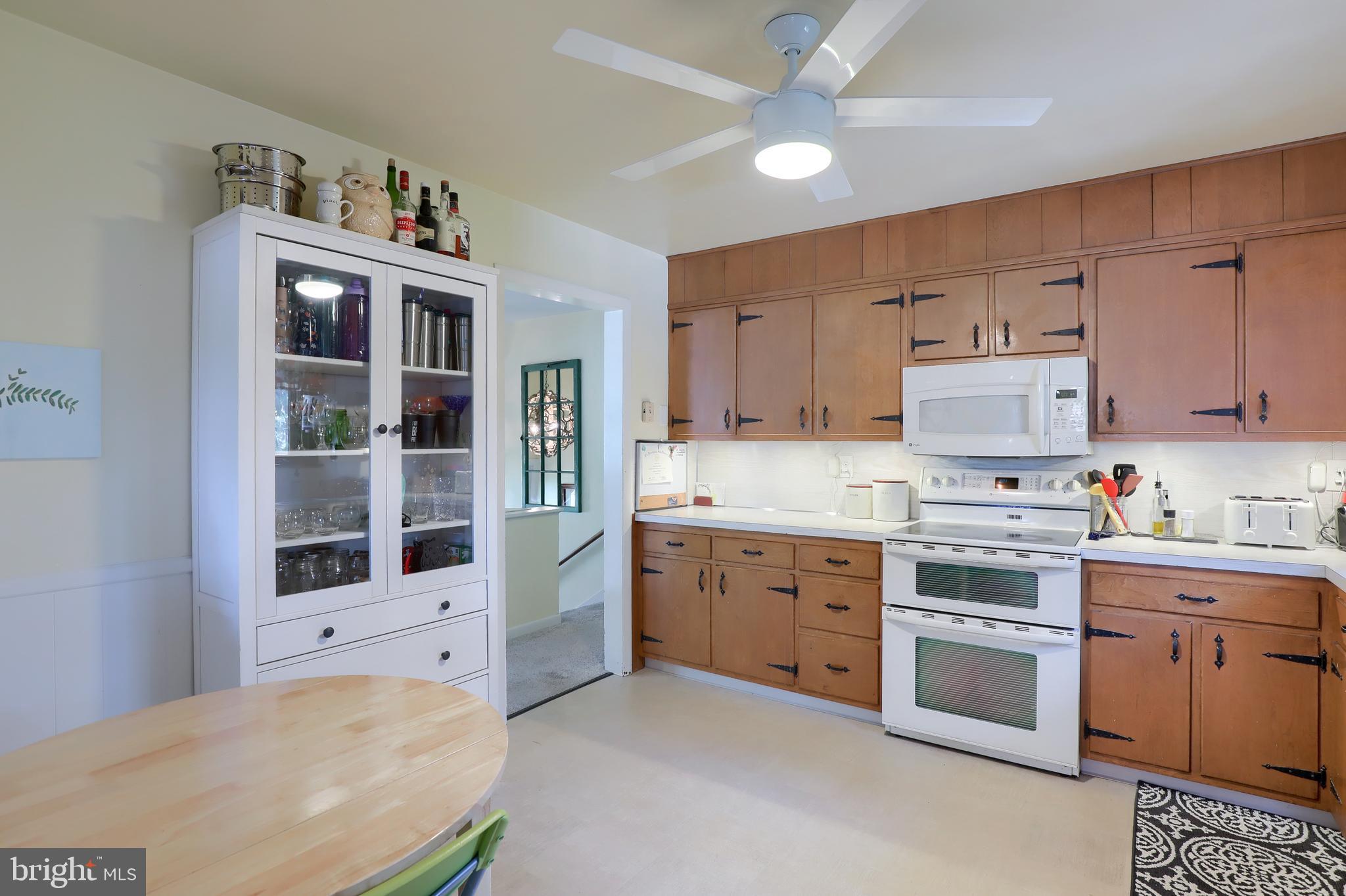 1307 Lookout Lane Lititz, PA 17543 - Photo 11 of 58 a kitchen with granite countertop white cabinets and white appliances