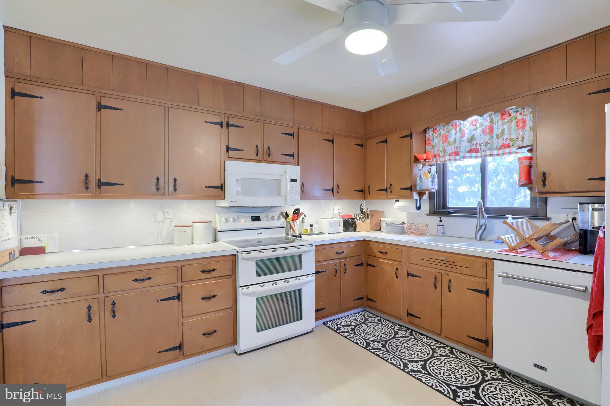1307 Lookout Lane Lititz, PA 17543 - Photo 14 of 58 a kitchen with cabinets appliances and a sink