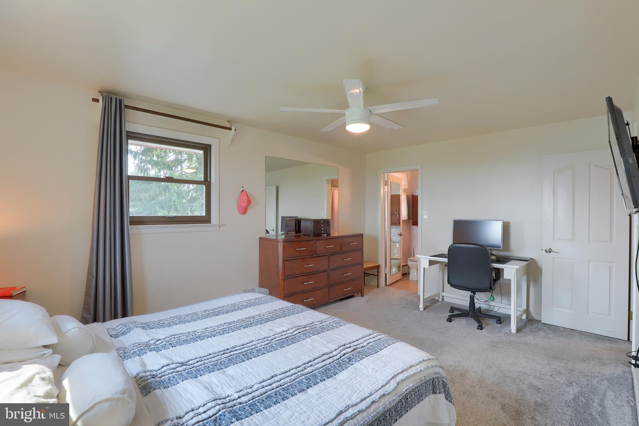 1307 Lookout Lane Lititz, PA 17543 - Photo 22 of 58 a bedroom with a bed and a chair