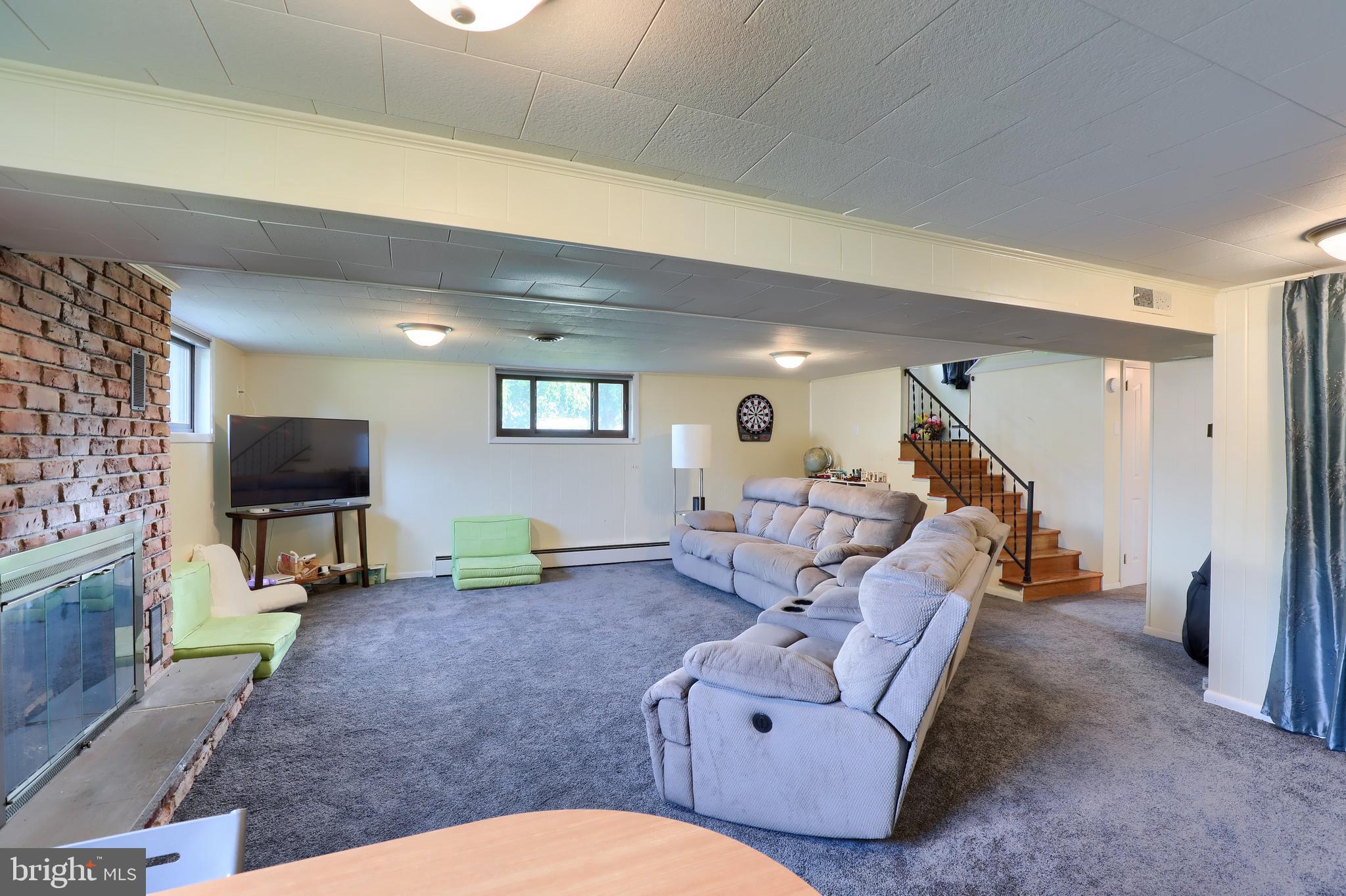 1307 Lookout Lane Lititz, PA 17543 - Photo 26 of 58 a living room with furniture and a flat screen tv