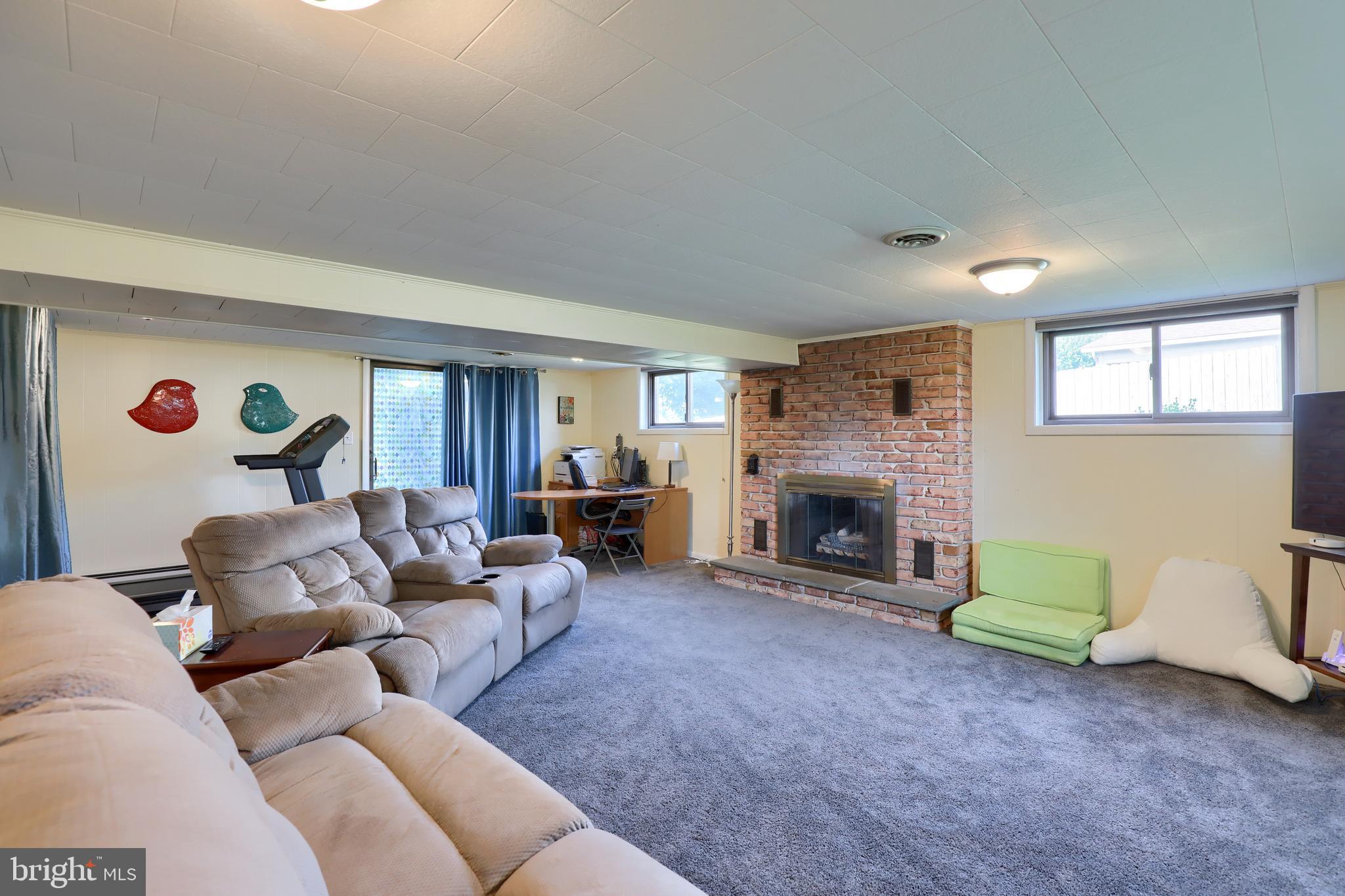 1307 Lookout Lane Lititz, PA 17543 - Photo 29 of 58 a living room with furniture and a fireplace