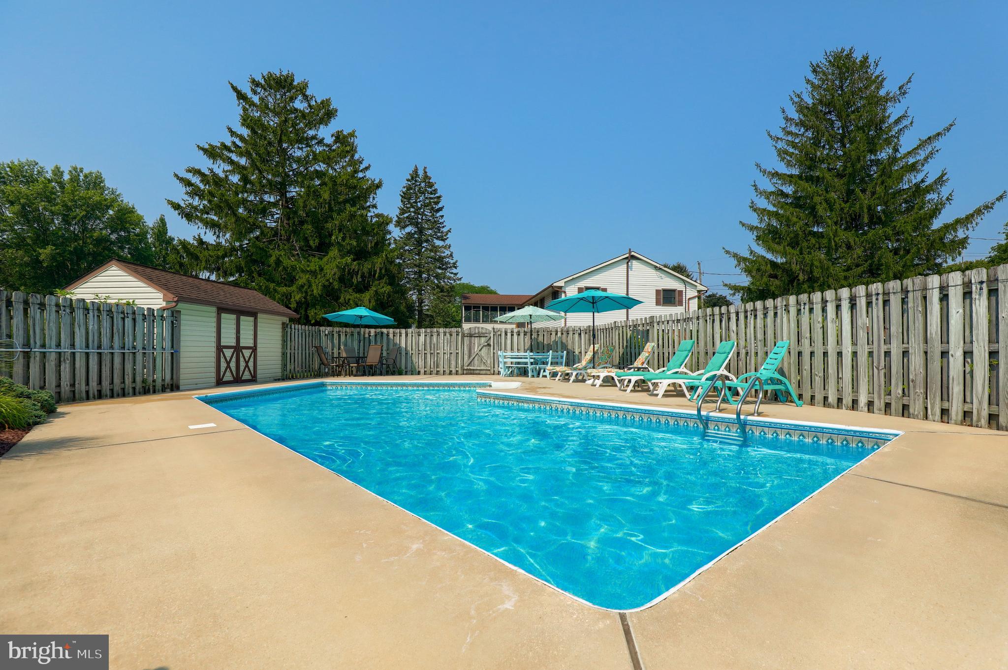 1307 Lookout Lane Lititz, PA 17543 - Photo 36 of 58 a view of a swimming pool with a patio and a garden