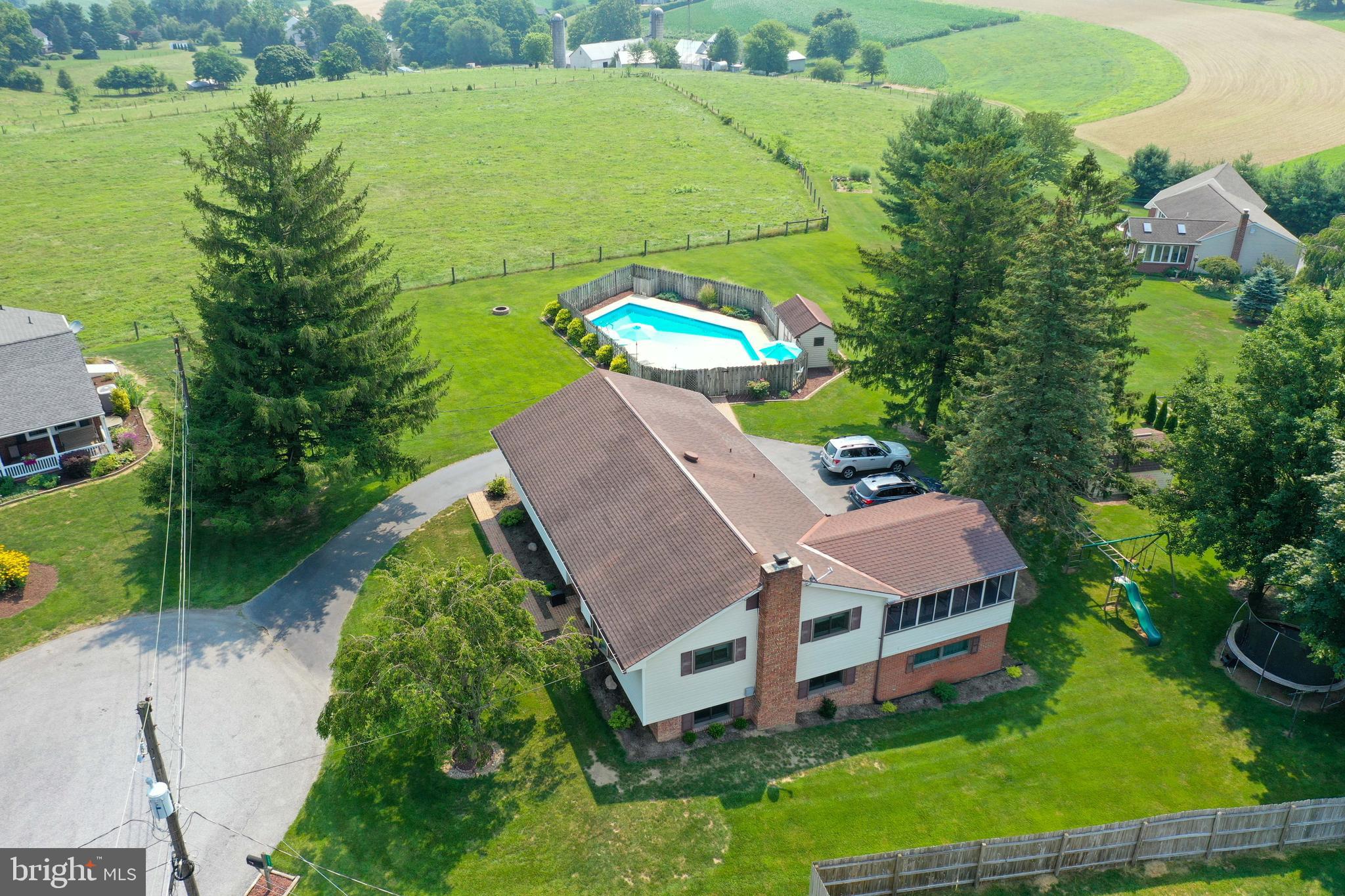 1307 Lookout Lane Lititz, PA 17543 - Photo 46 of 58 an aerial view of a house with a garden and lake view