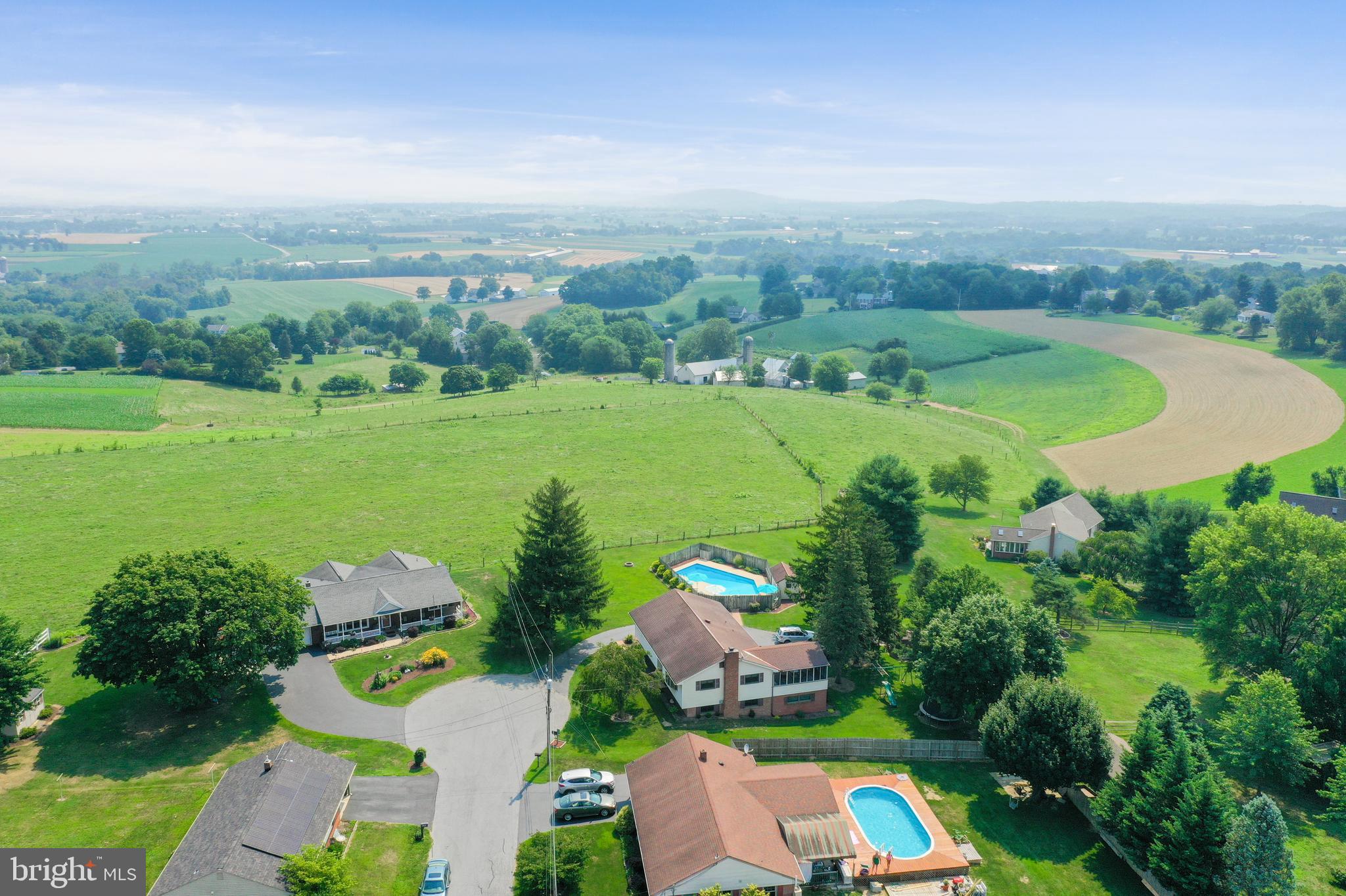 1307 Lookout Lane Lititz, PA 17543 - Photo 53 of 58 an aerial view of green landscape with trees houses and mountain view