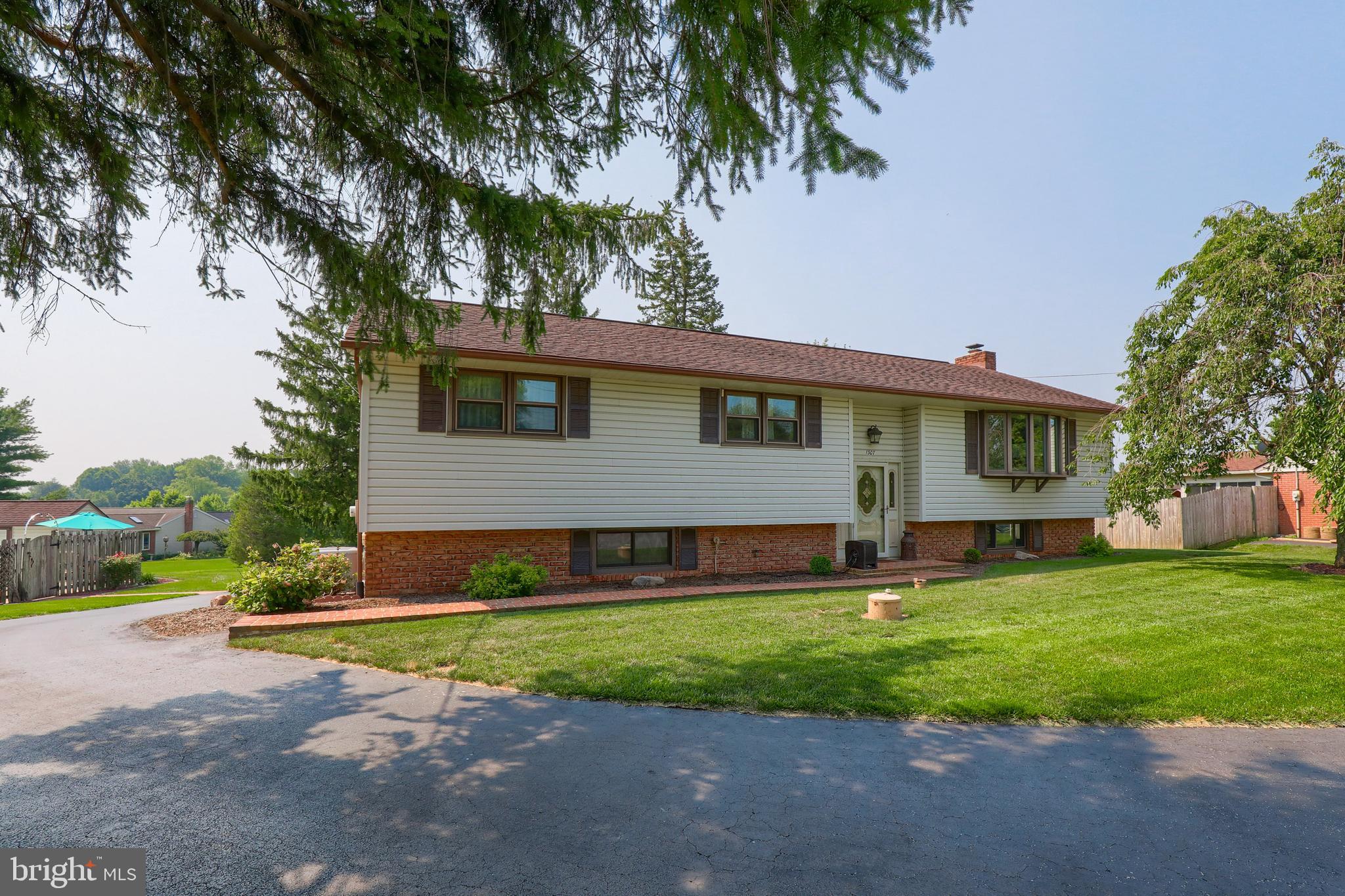 1307 Lookout Lane Lititz, PA 17543 - Photo 58 of 58 a front view of a house with a yard and garage