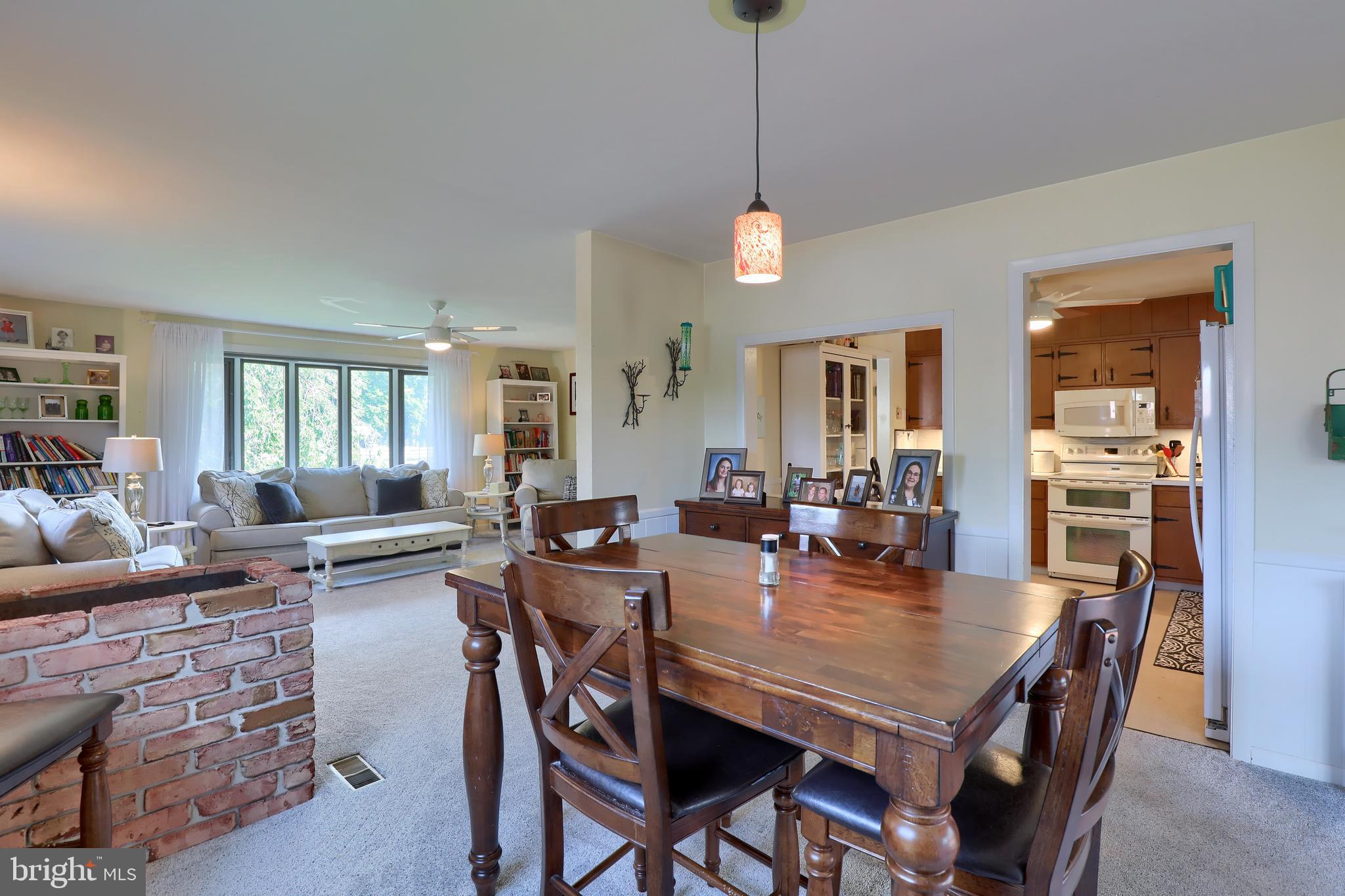 1307 Lookout Lane Lititz, PA 17543 - Photo 9 of 58 a view of a dining room and livingroom with furniture wooden floor a chandelier