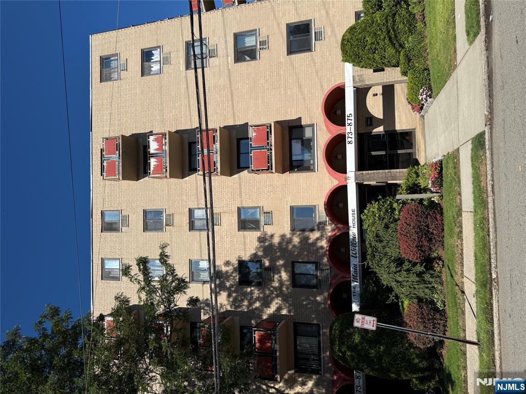 a front view of a building with street view