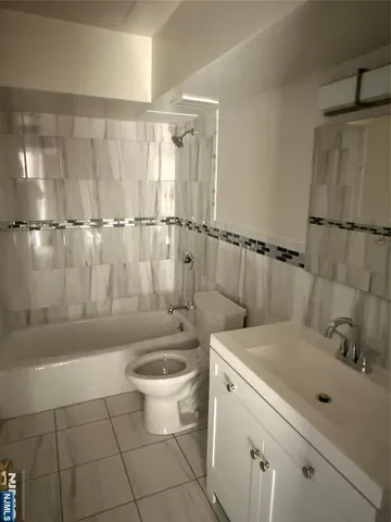 a bathroom with a sink a toilet and a bathtub