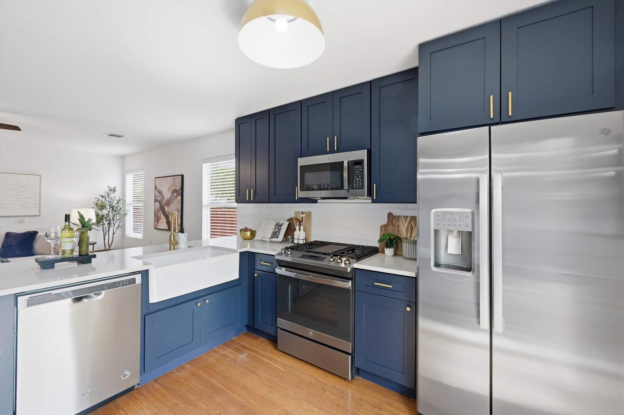 5321 Tower Trail Austin, TX 78723 - Photo 11 of 22 a kitchen with a refrigerator sink and wooden cabinets