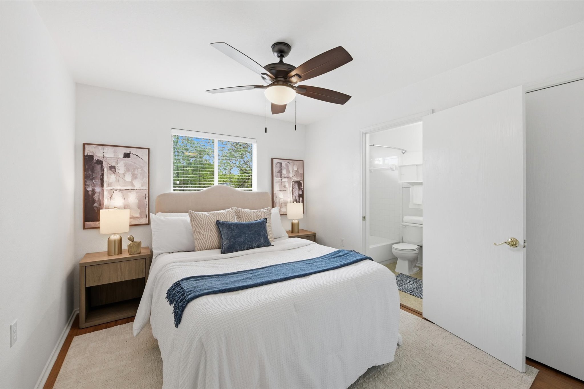 5321 Tower Trail Austin, TX 78723 - Photo 14 of 22 a bedroom with a bed and a ceiling fan