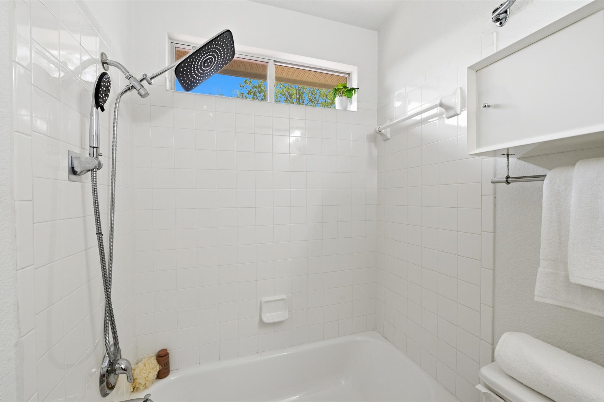 5321 Tower Trail Austin, TX 78723 - Photo 16 of 22 a bathroom with a bathtub and a shower