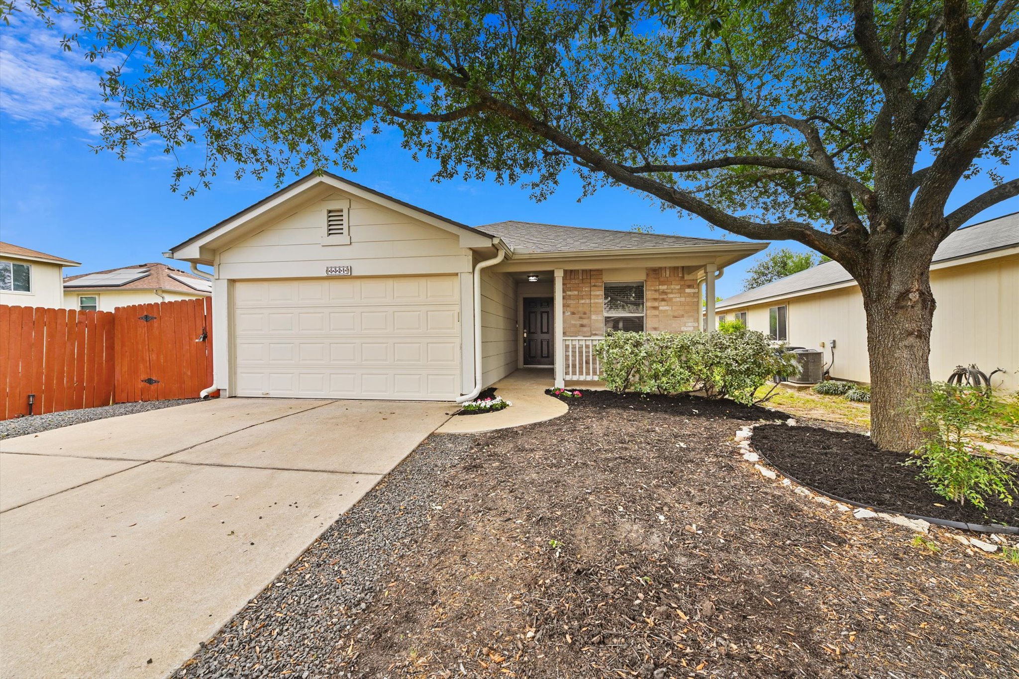 5321 Tower Trail Austin, TX 78723 - Photo 2 of 22 a front view of a house with a yard and garage