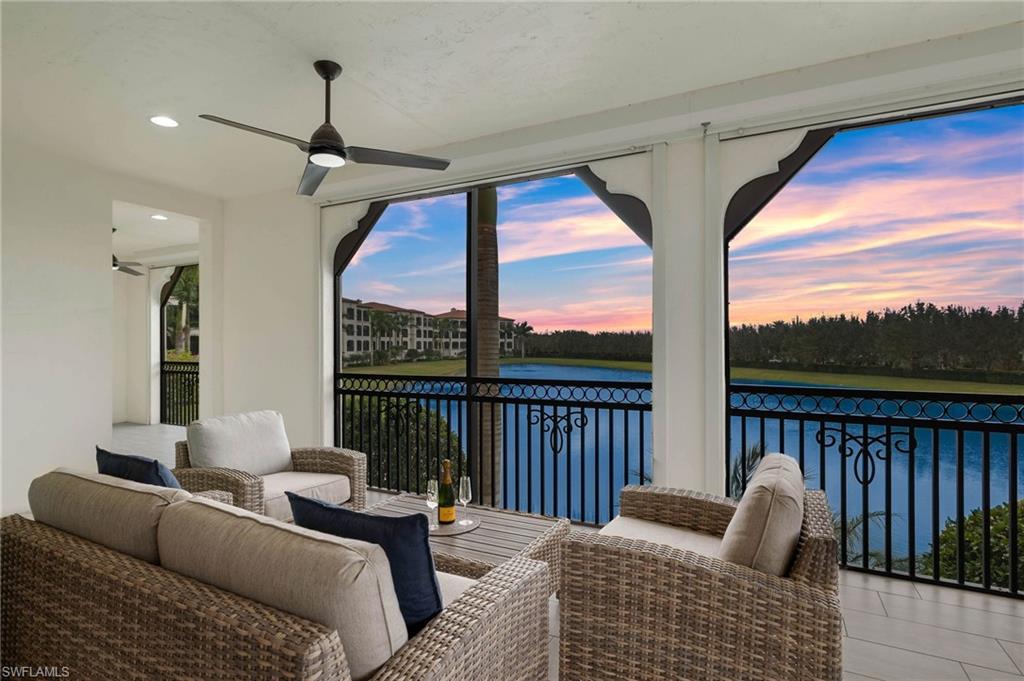 Lanai featuring a water view, recessed lighting, and decorative ceiling fans.