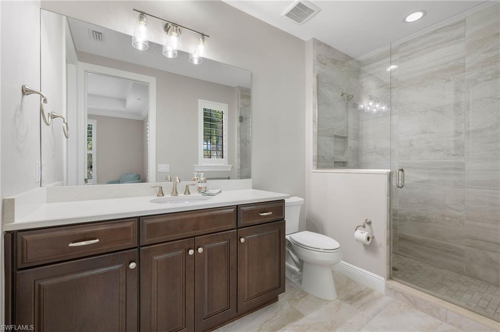 16449 Carrara Way, Unit 101 Naples, FL 34110 - Photo 20 of 35 Guest Bathroom 1 with a walk in shower.