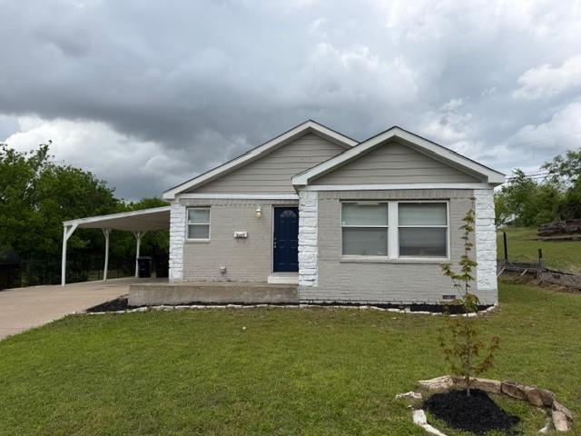 2321 Ridgeview Street Fort Worth, TX 76119 - Photo 1 of 10 Single-story residence featuring a painted brick and siding exterior, a dark blue entry door, and a covered carport