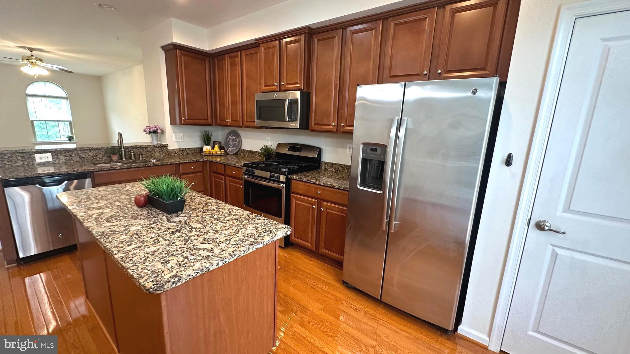 7343 Old Calvary Road Hanover, MD 21076 - Photo 16 of 35 a kitchen with a refrigerator stove and sink