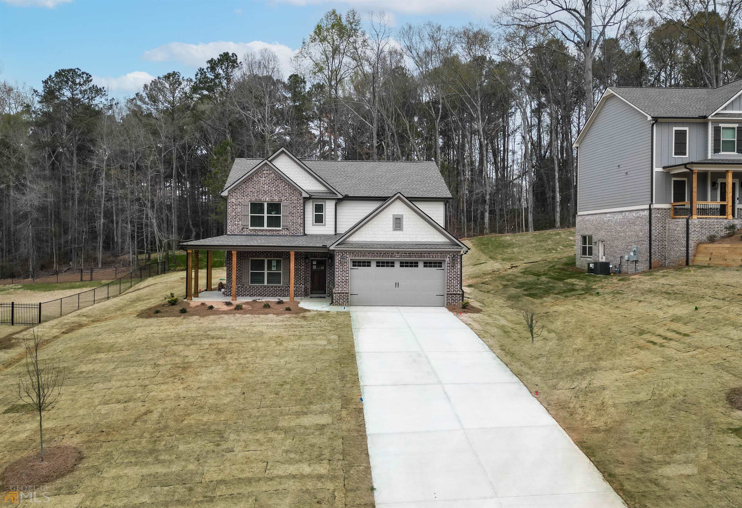 a view of a house with large trees