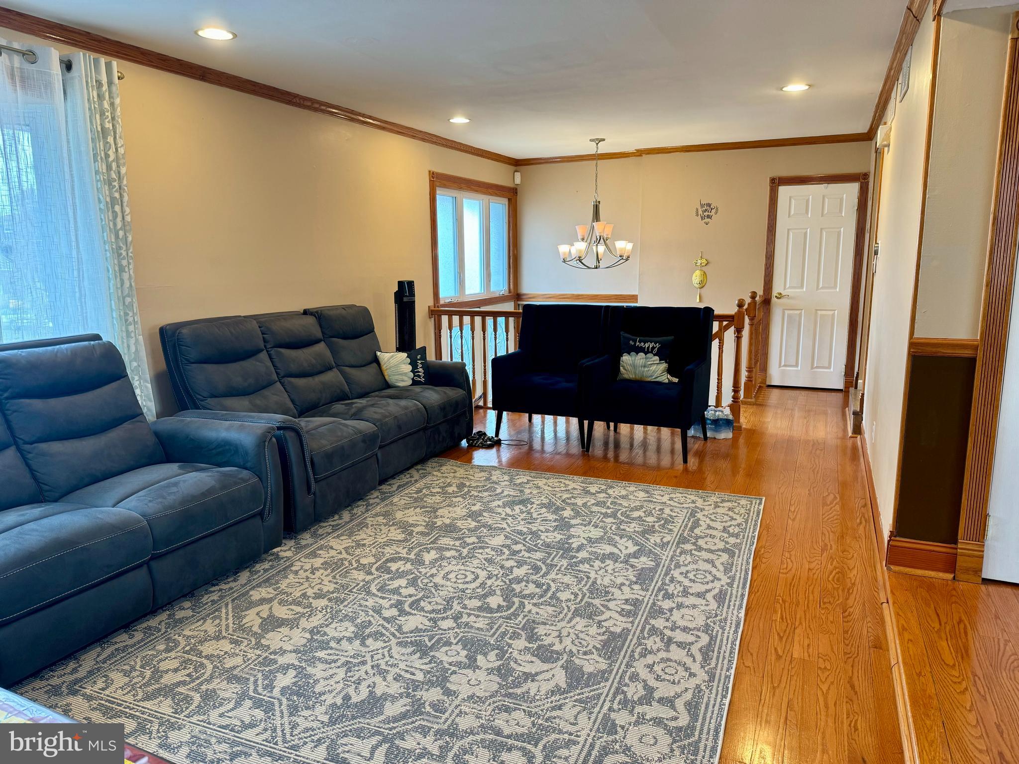 10100 Galahad Road Philadelphia, PA 19116 - Photo 4 of 17 a living room with a couch and a table