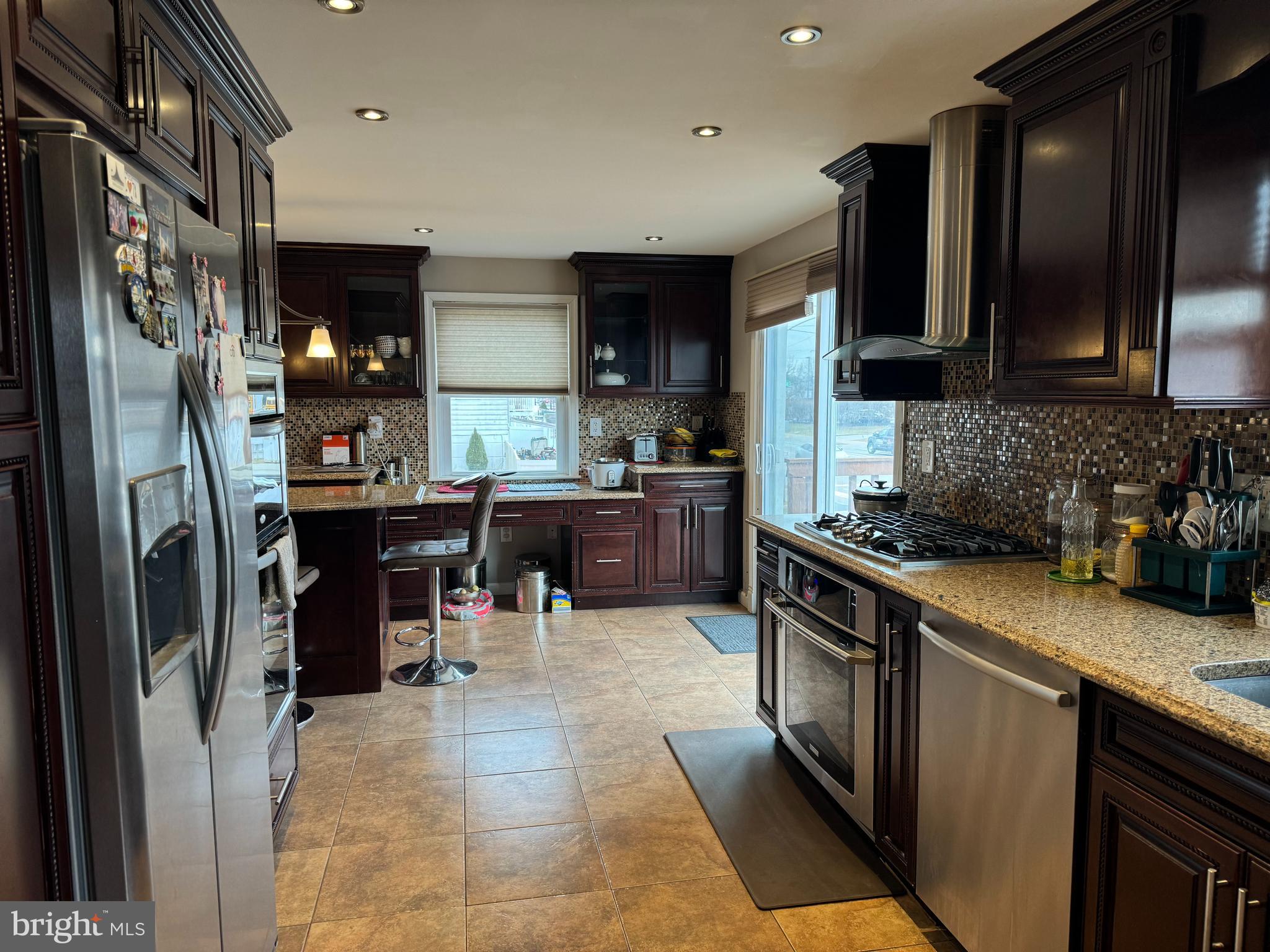 10100 Galahad Road Philadelphia, PA 19116 - Photo 7 of 17 a kitchen with stainless steel appliances granite countertop a refrigerator stove and sink