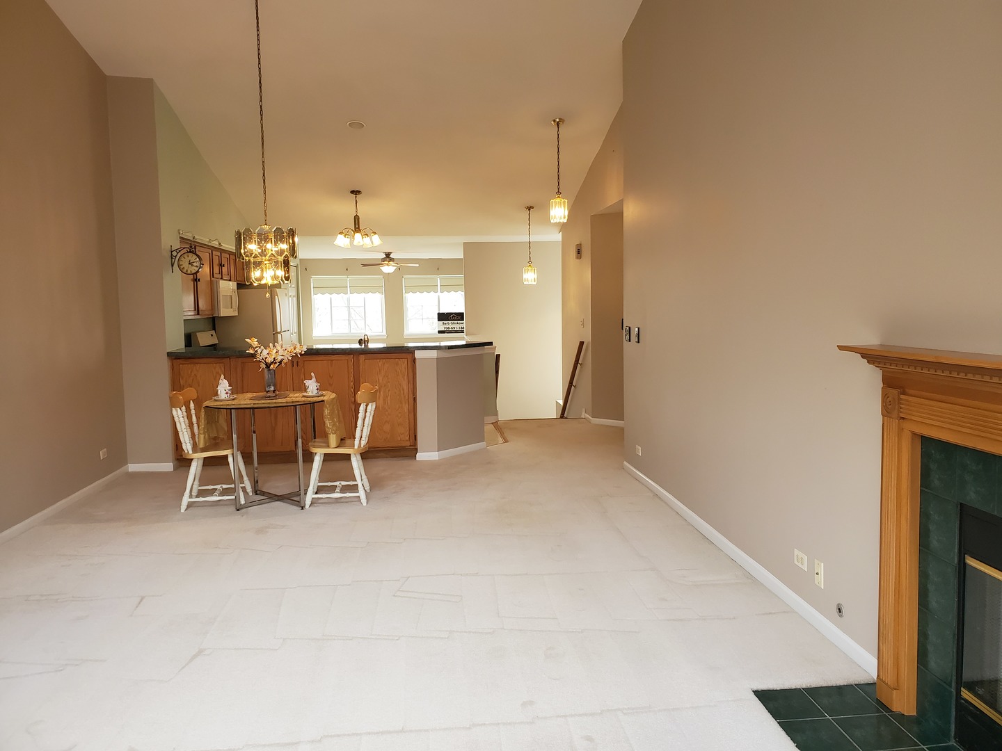 8225 Ripple Ridge, Unit 8225 Darien, IL 60561 - Photo 12 of 21 a dining room with furniture and a chandelier