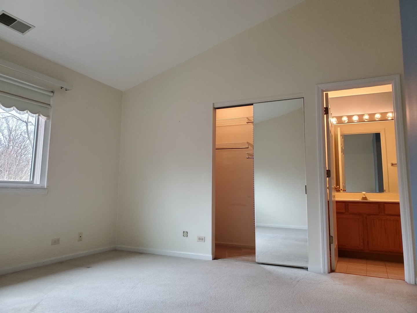 8225 Ripple Ridge, Unit 8225 Darien, IL 60561 - Photo 13 of 21 an empty room that has a window
