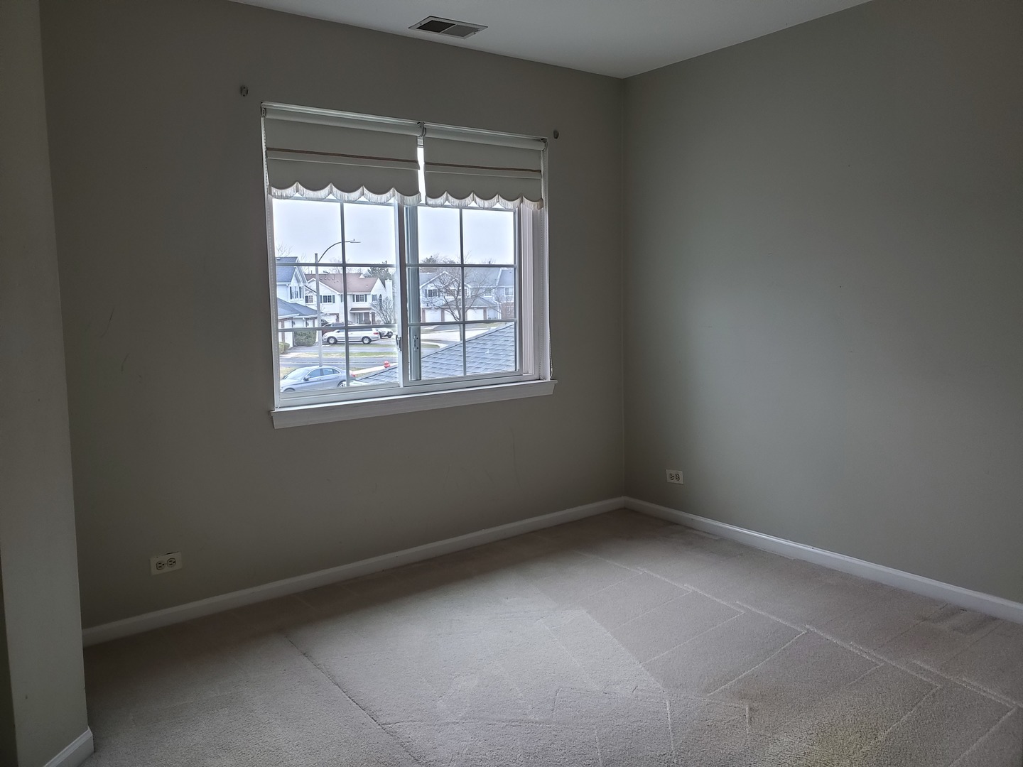 8225 Ripple Ridge, Unit 8225 Darien, IL 60561 - Photo 15 of 21 an empty room with a window