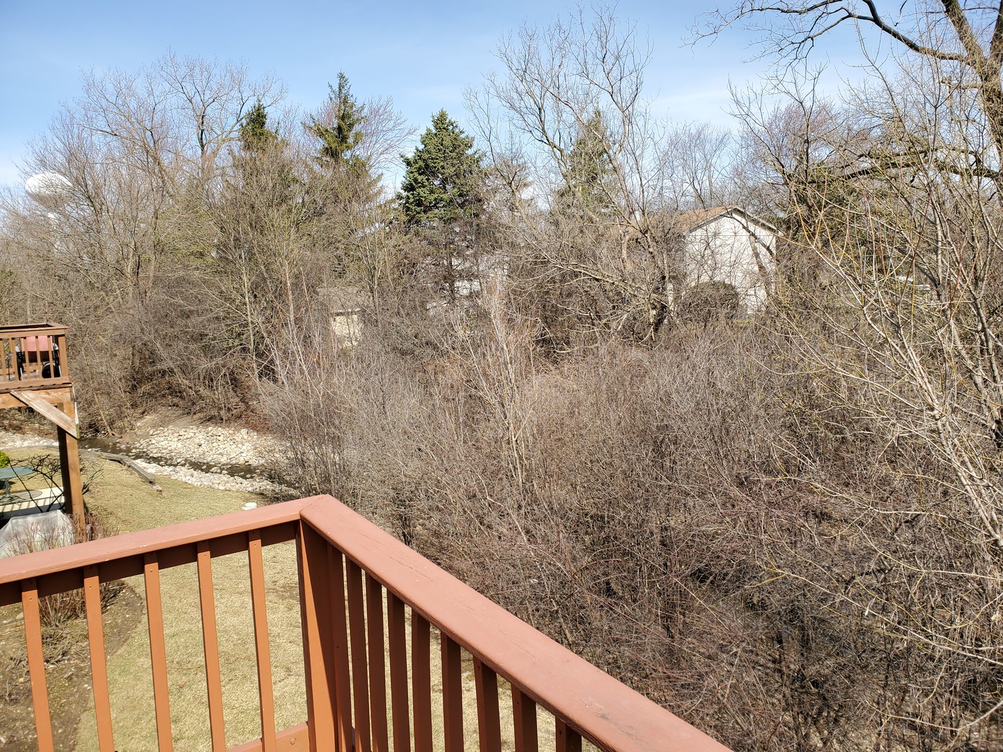 8225 Ripple Ridge, Unit 8225 Darien, IL 60561 - Photo 19 of 21 a balcony with trees in front of it