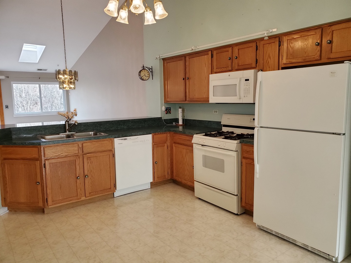 8225 Ripple Ridge, Unit 8225 Darien, IL 60561 - Photo 6 of 21 a kitchen with granite countertop white cabinets and white appliances