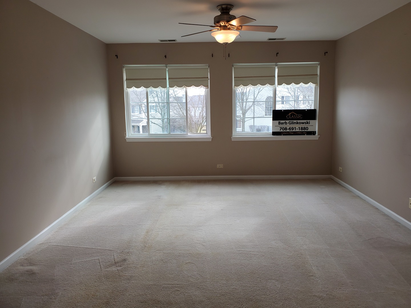 8225 Ripple Ridge, Unit 8225 Darien, IL 60561 - Photo 8 of 21 a view of an empty room with a window