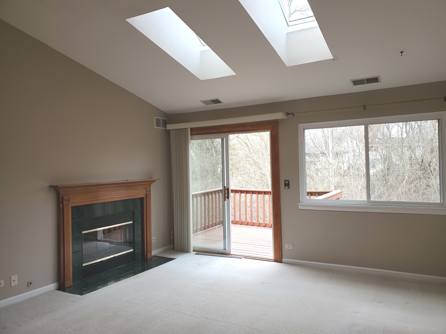 8225 Ripple Ridge, Unit 8225 Darien, IL 60561 - Photo 10 of 21 an empty room with windows and fireplace