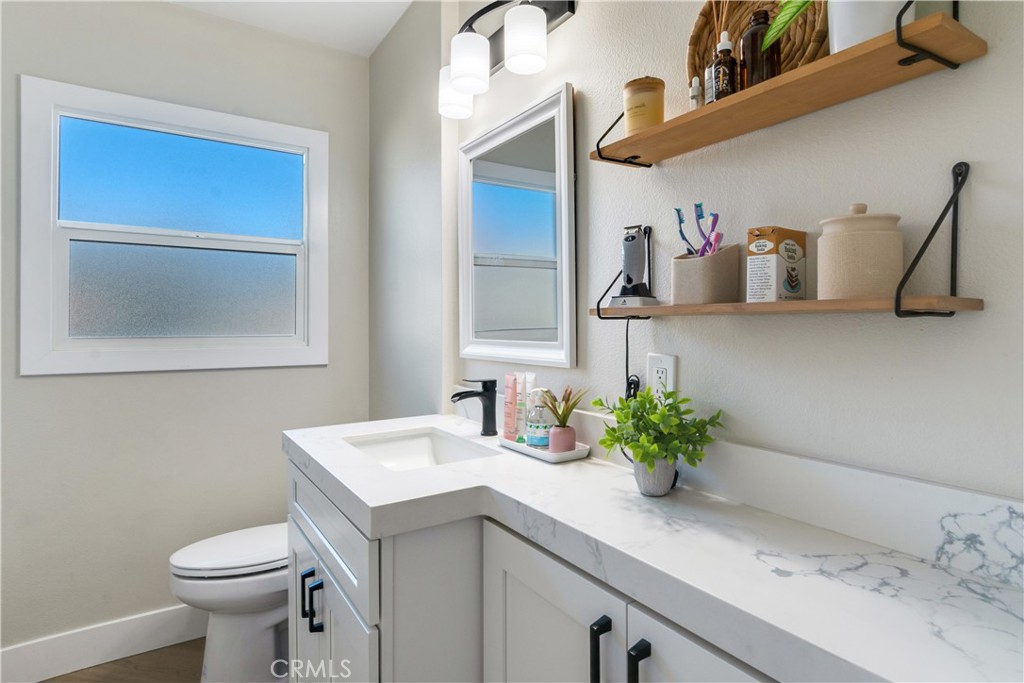 6755 Rainier Court Riverside, CA 92506 - Photo 14 of 23 a bathroom with a sink and a toilet