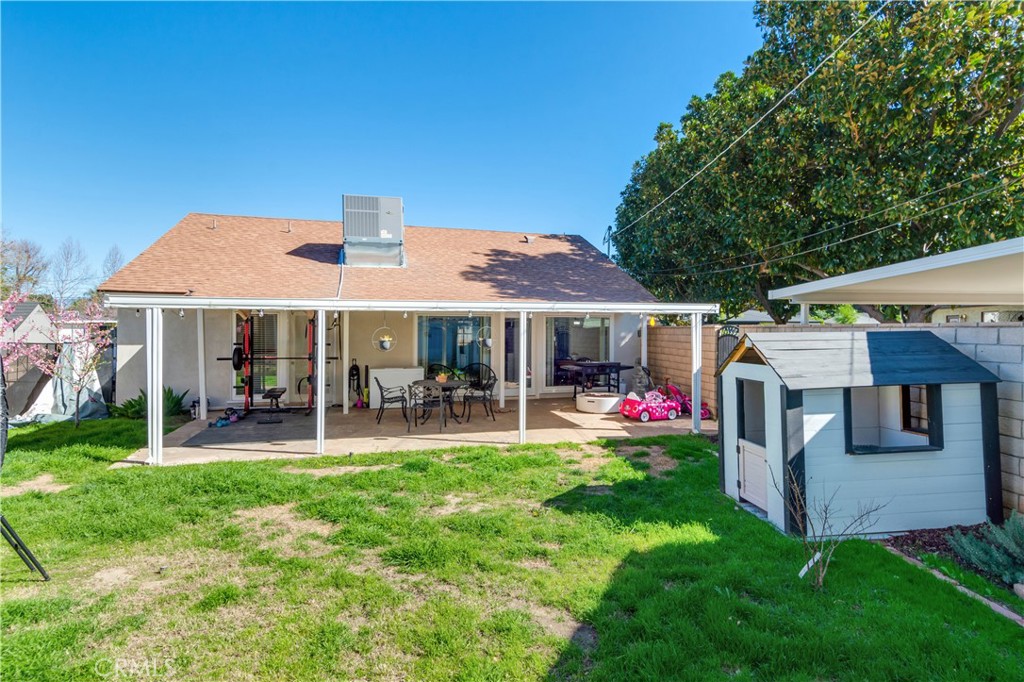6755 Rainier Court Riverside, CA 92506 - Photo 18 of 23 a front view of a house with swimming pool garden and patio