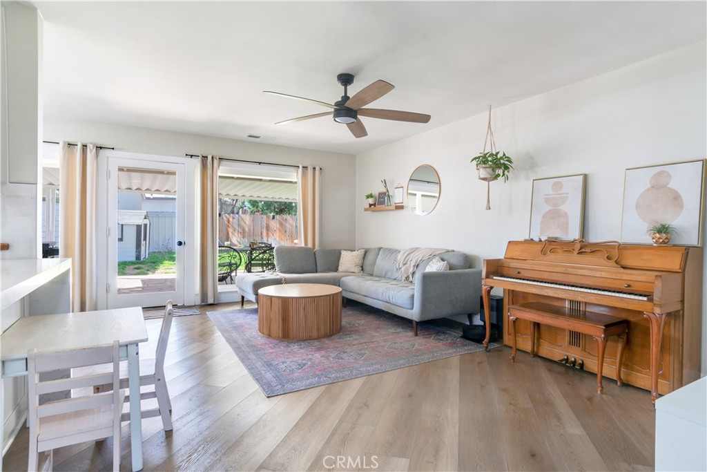 6755 Rainier Court Riverside, CA 92506 - Photo 7 of 23 a living room with furniture a ceiling fan and a window