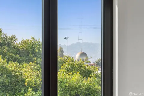 a kitchen with stainless steel appliances a stove a sink and a white cabinets