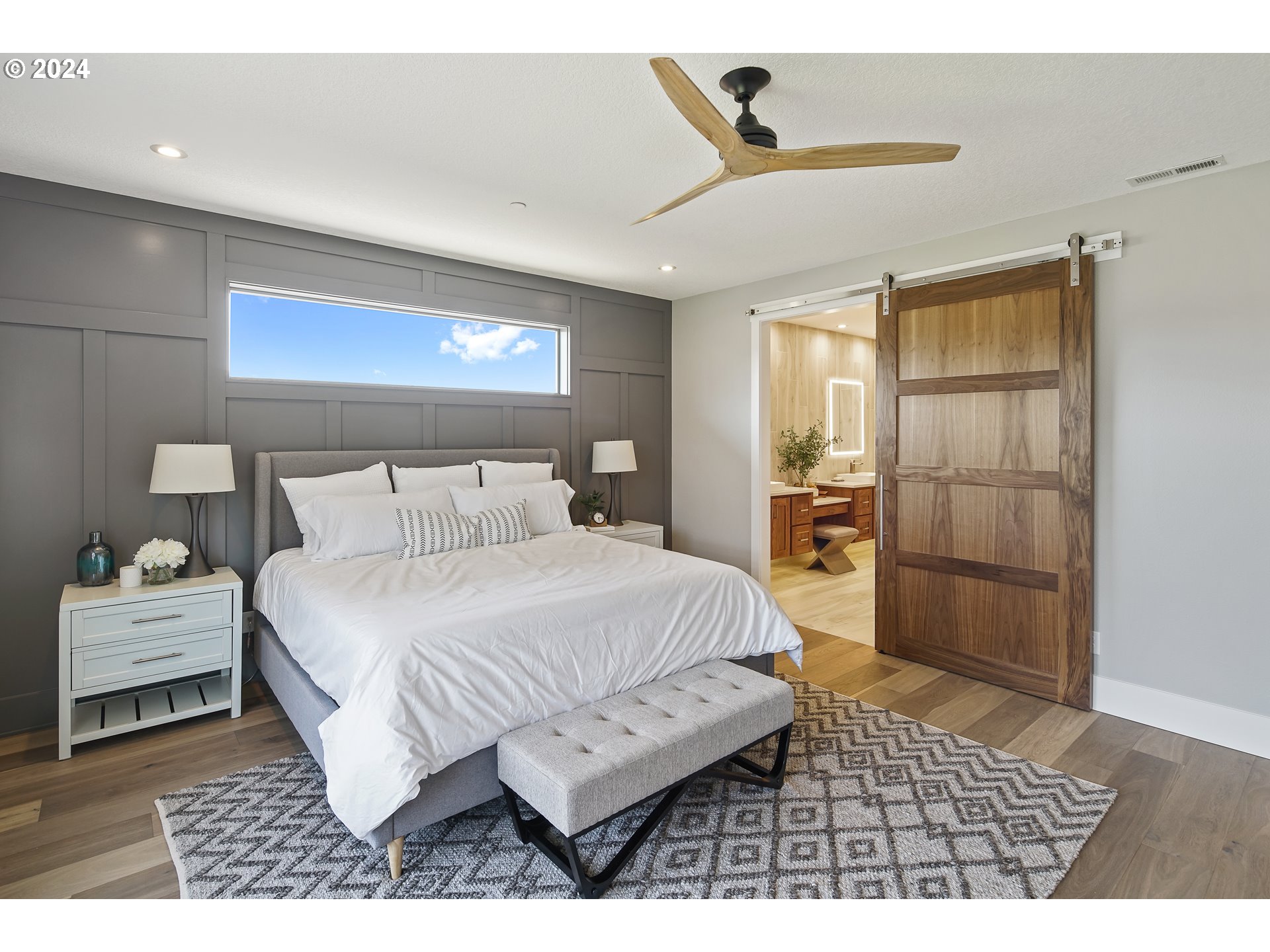 17711 Northeast 25th Avenue, Unit LOT 8 Ridgefield, WA 98642 - Photo 18 of 39 a bedroom with a bed and a view of kitchen