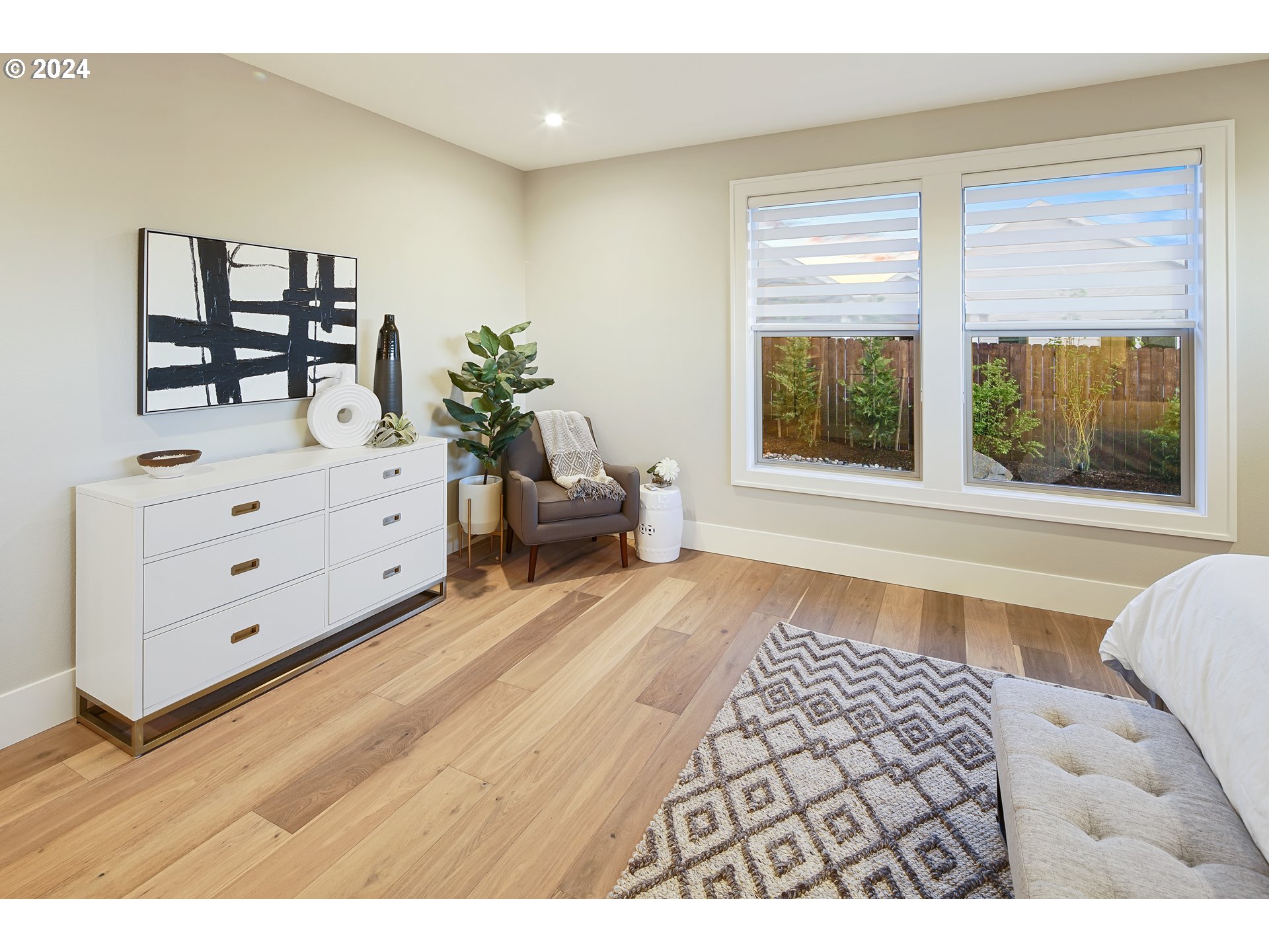 17711 Northeast 25th Avenue, Unit LOT 8 Ridgefield, WA 98642 - Photo 19 of 39 a spacious bedroom with a bed and a window
