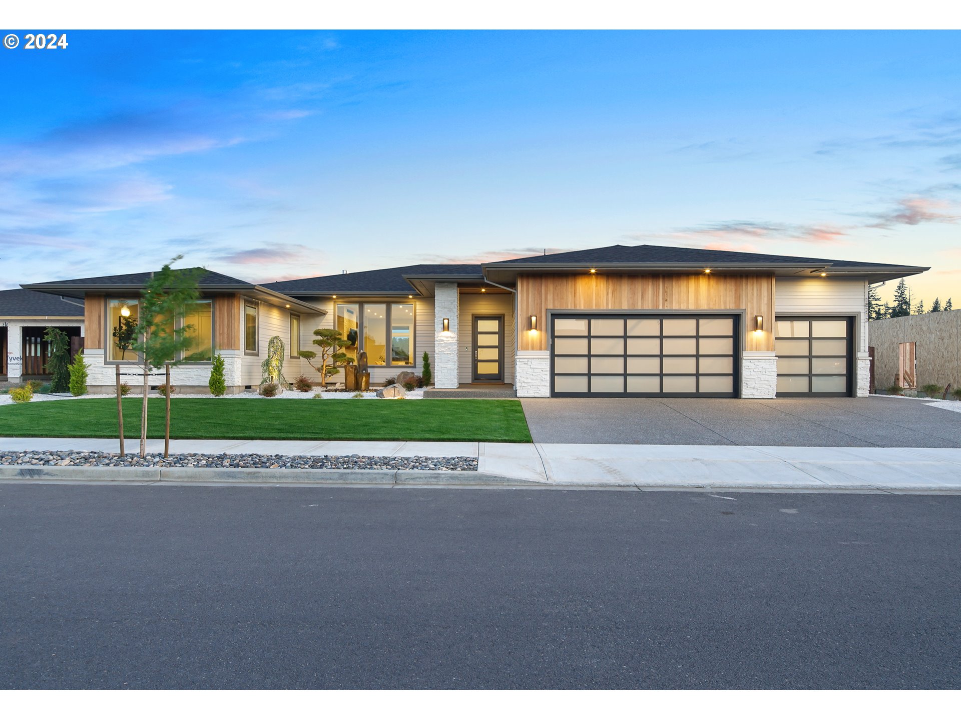 17711 Northeast 25th Avenue, Unit LOT 8 Ridgefield, WA 98642 - Photo 2 of 39 a view of house with a garden and pathway
