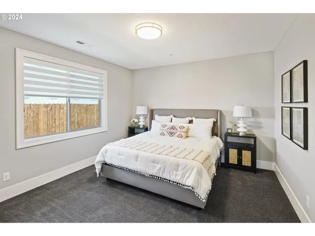 a bedroom with a bed and a table