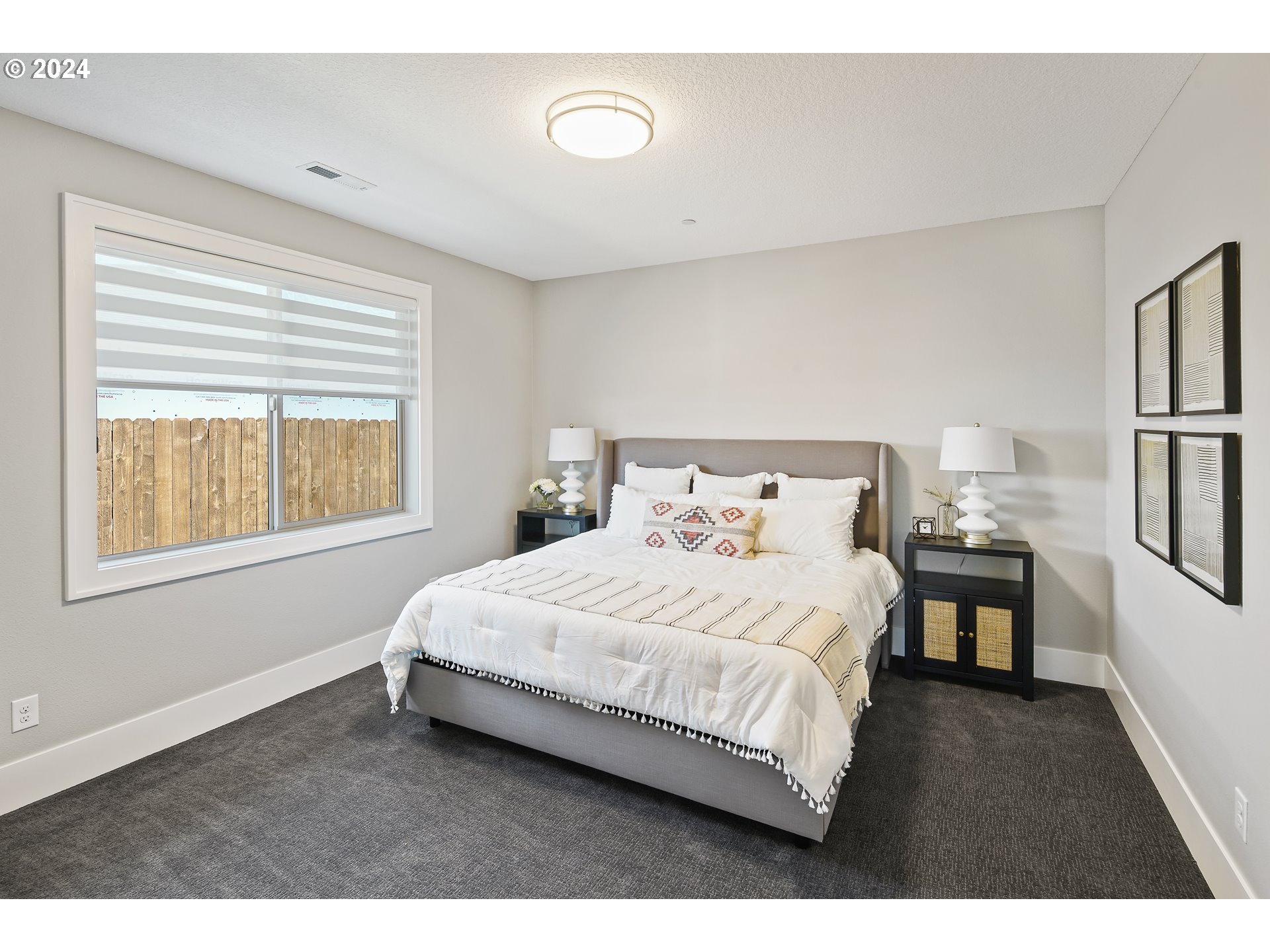 17711 Northeast 25th Avenue, Unit LOT 8 Ridgefield, WA 98642 - Photo 28 of 39 a bedroom with a bed and a table