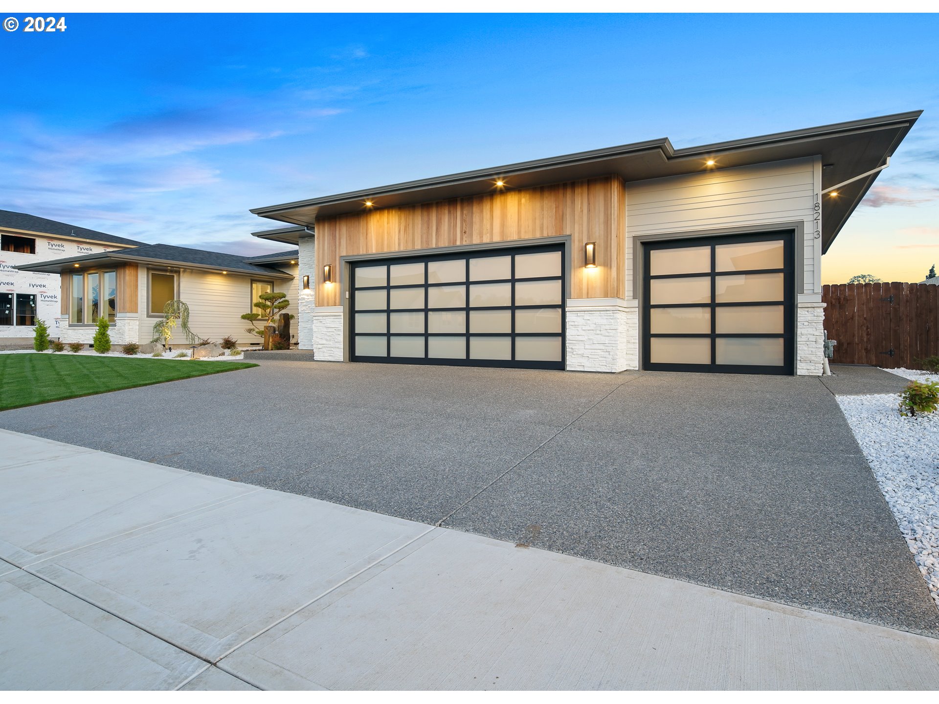 17711 Northeast 25th Avenue, Unit LOT 8 Ridgefield, WA 98642 - Photo 3 of 39 a view of a house with a road and garage