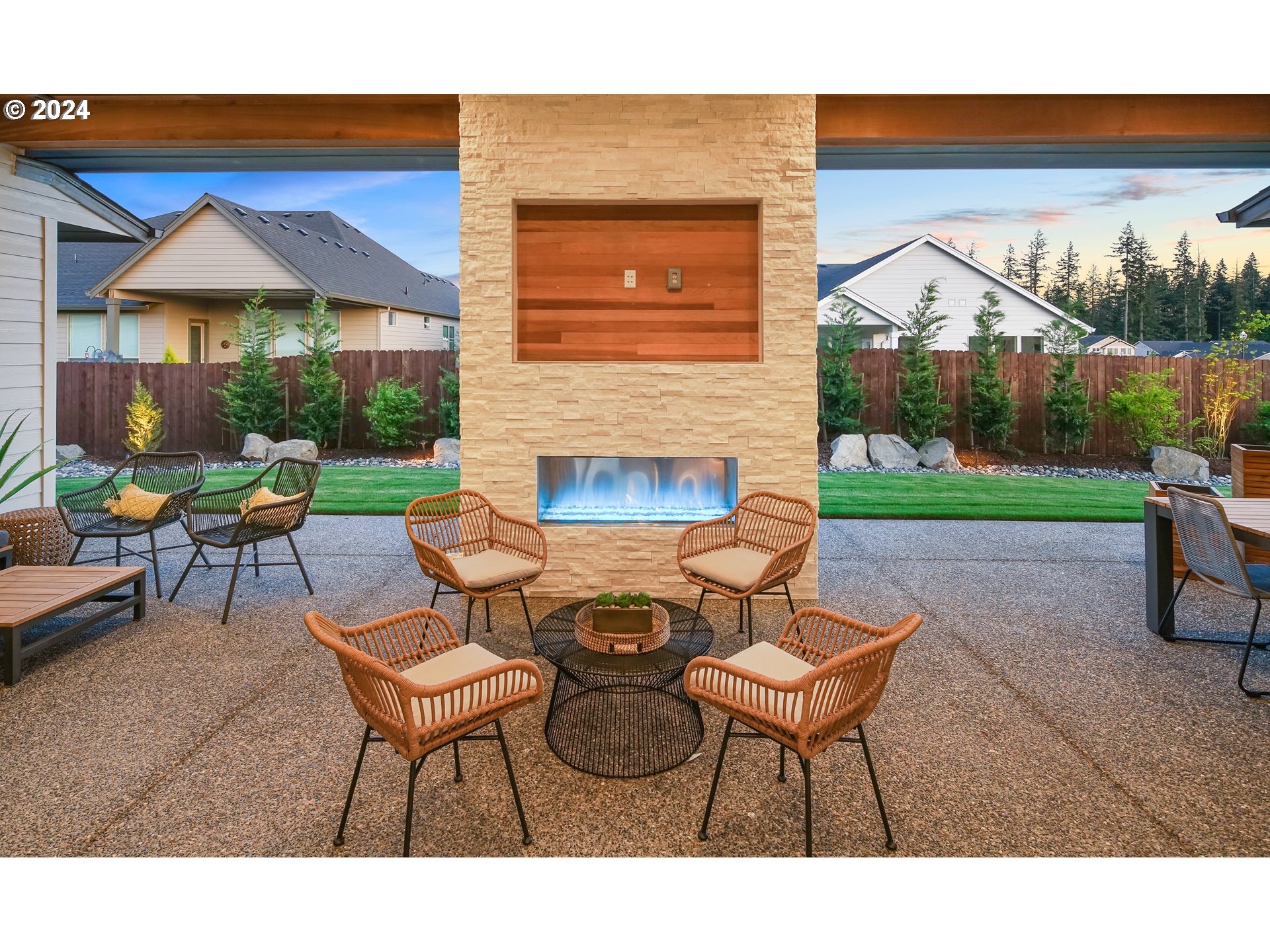 17711 Northeast 25th Avenue, Unit LOT 8 Ridgefield, WA 98642 - Photo 35 of 39 a backyard of a house with table and chairs