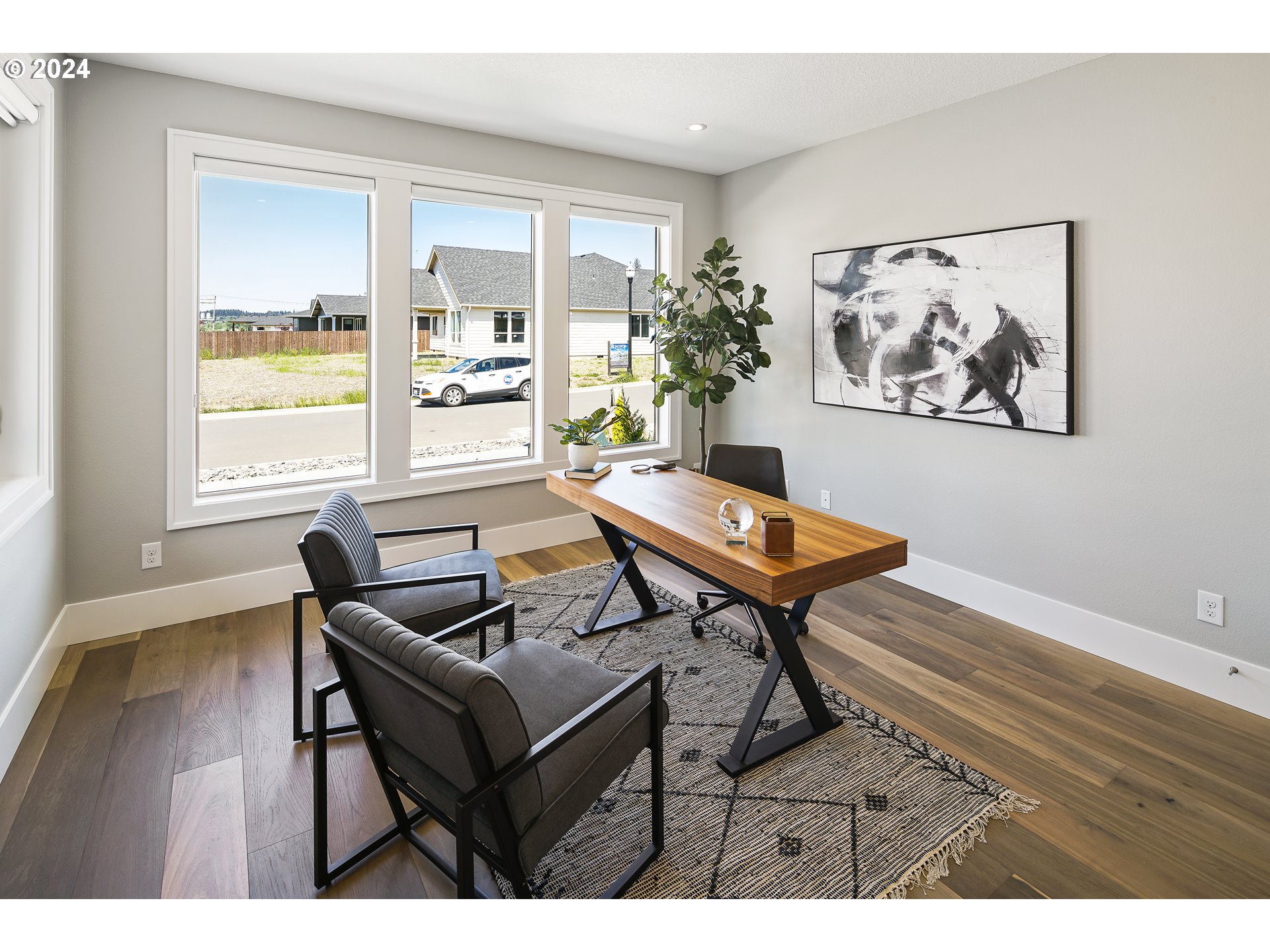 17711 Northeast 25th Avenue, Unit LOT 8 Ridgefield, WA 98642 - Photo 5 of 39 a living room with furniture and a large window
